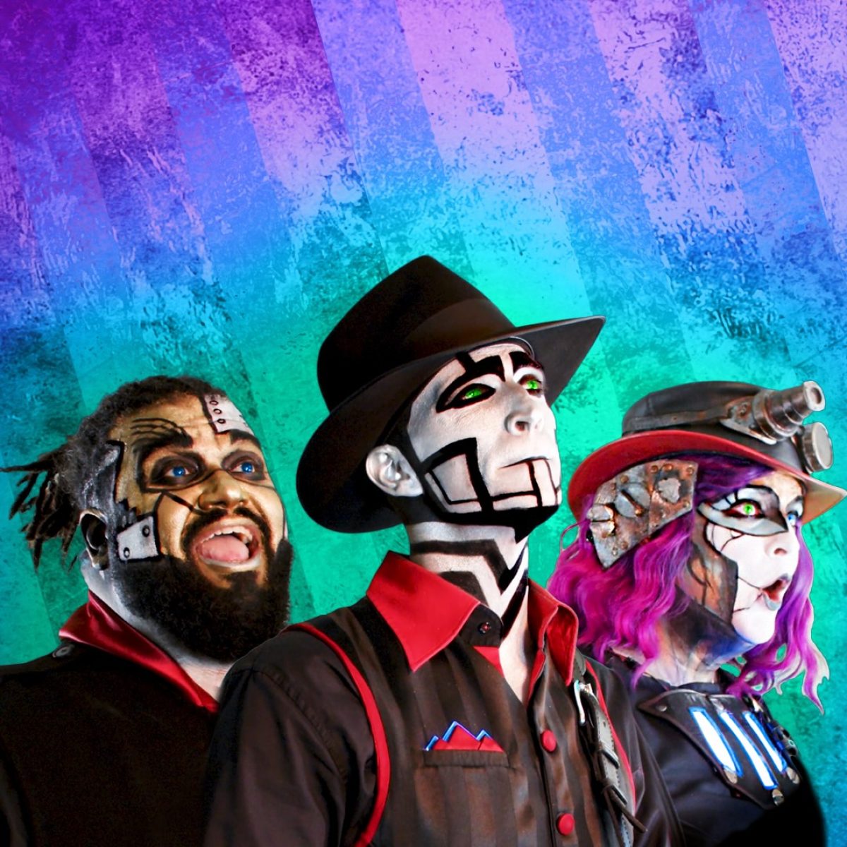 3 musicians wearing robotic style makeup and steampunk costumes